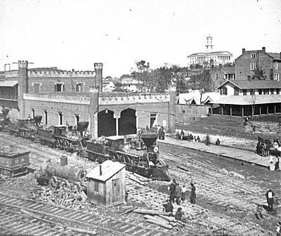 Nashville railroad yard with the Tennessee state capitol building in the background — the 102nd Ohio guarded these vital supply lines