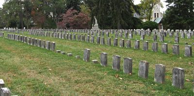 Mixed known and unknown grave markers at Antietam National Cemetery — illustrating how identified and unidentified soldiers rest side by side